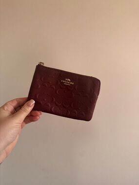 Coach Burgundy Embossed Leather Zip Pouch with Gold Logo